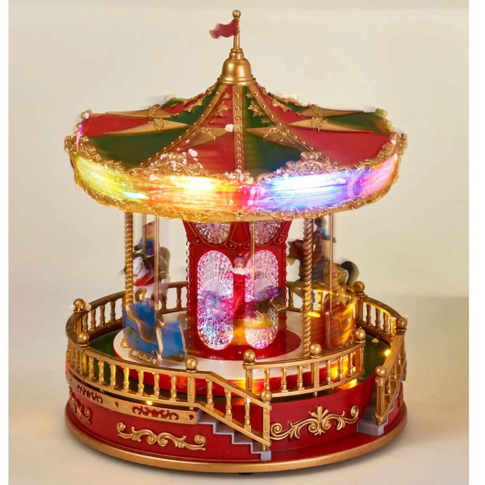 Świąteczna karuzela LED z muzyką i obrotowymi figurkami, 23 x 28 cm
